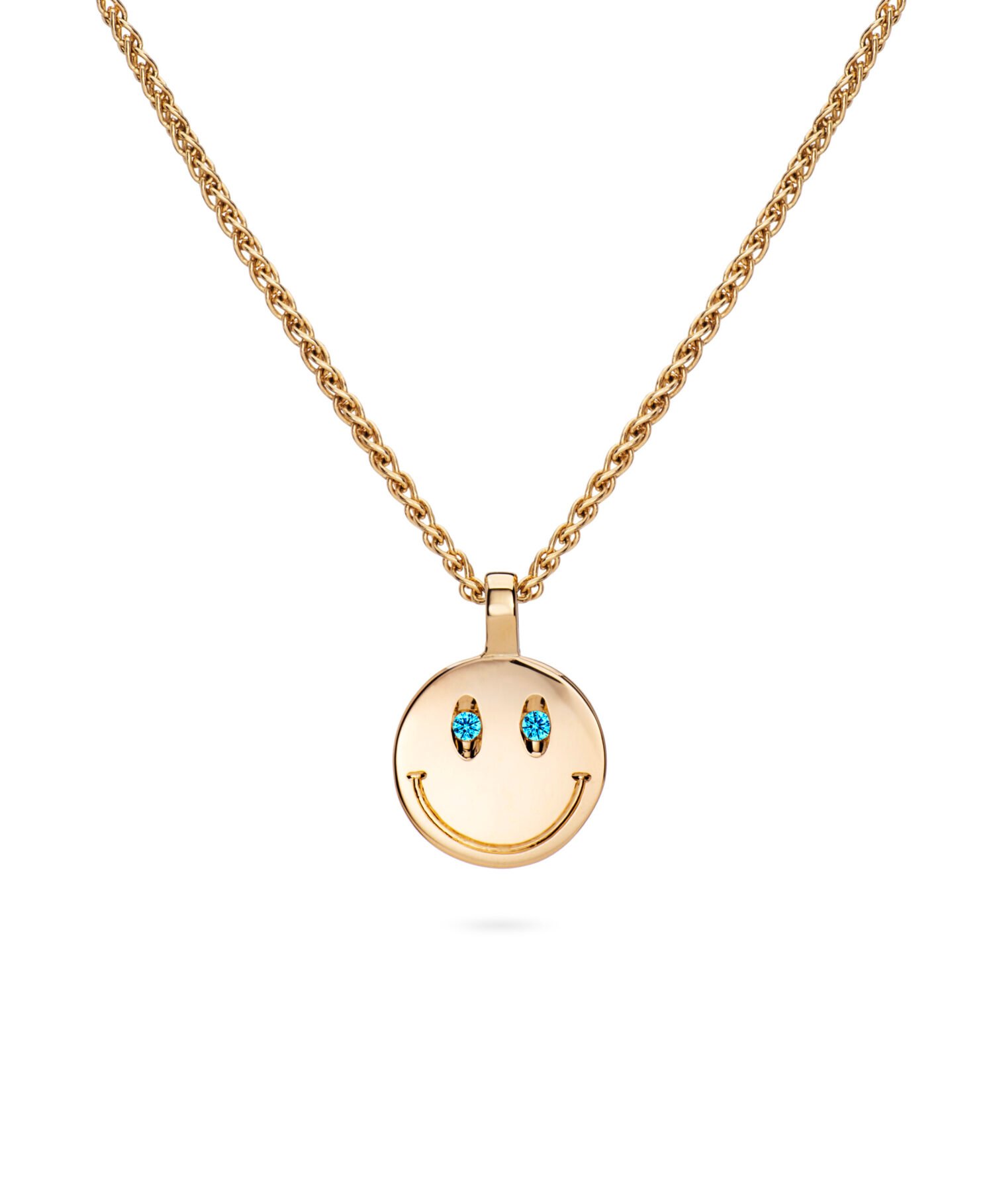 a gold necklace with a smiley face pendant