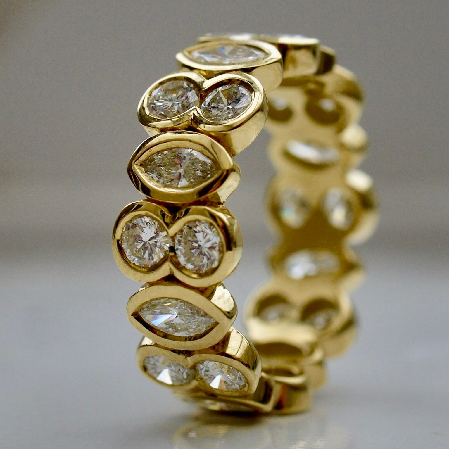 a bespoke gold ring with diamonds