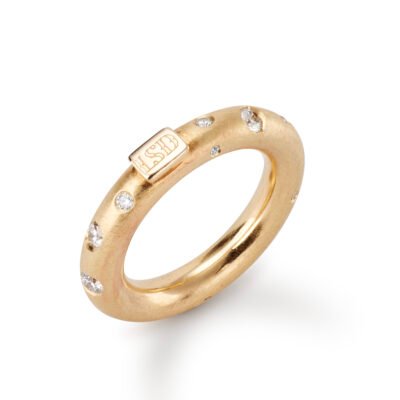 gold band with scattered diamonds