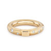 gold band with scattered diamonds