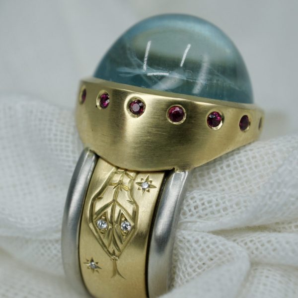 18ct gold and platinum spinning rattlesnake ring with aquamarine, diamonds and rubies